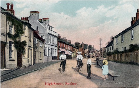 Post Card of the High Street, Watford, from about 19088, showing two ladies on bicycles, and published by Middleton & Sons, stationers, of Bushey